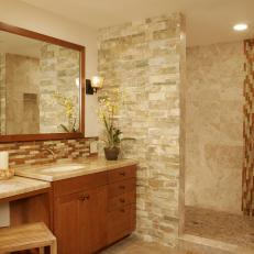 Neutral Natural Stone Bathroom With Mosaic Glass Tile Backsplash
