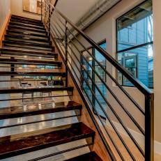 Contemporary High-Gloss Staircase With Industrial Accents