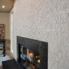Custom Black Fireplace With Textured Tile Surround