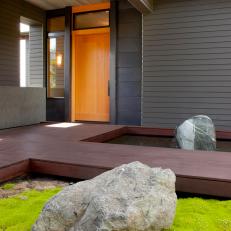 Boulders Flank Walkway to Covered Porch