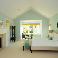 Large Transitional Bedroom Features Soft Blue Walls