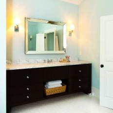Black Vanity Provides Contrast in Soft Blue Bathroom