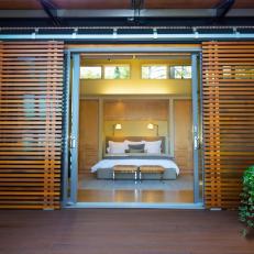 Contemporary Bedroom Opens to Wood Deck