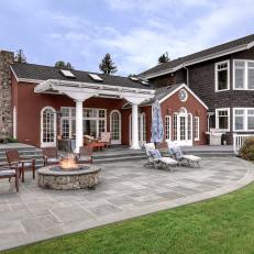 Traditional Coastal Home With Back Patio and Fire Pit
