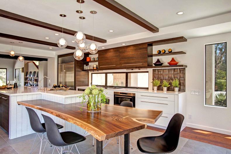 Contemporary White Kitchen With Wood Table, Brown Beams & Black Chairs