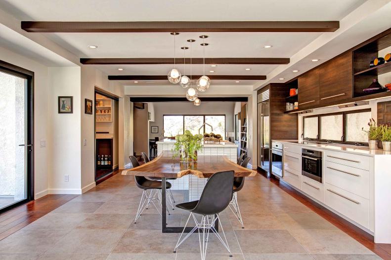 Contemporary White Kitchen With Brown Beams & Neutral Tile Floor