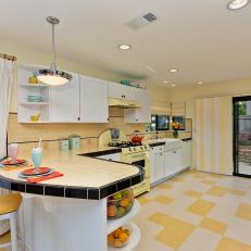 Retro Kitchen With Buttery Yellow Countertop and Checkered Floors