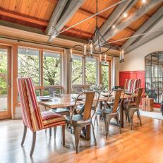 Eclectic Dining Room With Exposed Steel Beams