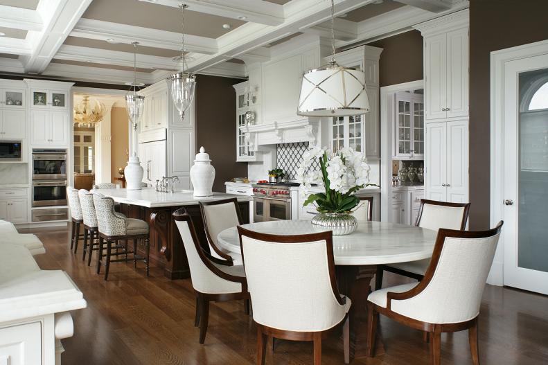 Brown Open Kitchen With Round Table & High-Contast Chairs