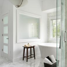 Tranquil White Bathroom With Freestanding Tub & Marble Floor