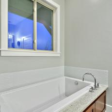 Relaxing Bathtub in Bright, Transitional Bathroom