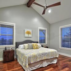 Transitional Bedroom Boasts High Ceilings & Warm Wood Floors