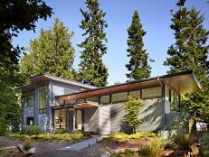 Contemporary Home Exterior With Evergreen Landscape