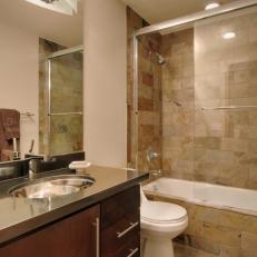 Calm, Modern Bathroom Features Earth-Toned Tile Shower