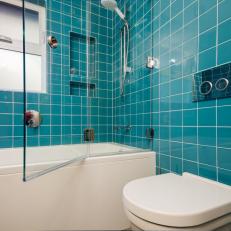 Glass-Enclosed Shower With Bold Teal Tiles