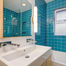 Modern Bathroom With Teal Shower Tiles