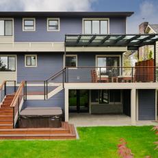 Contemporary Back Deck Features Custom Glass Awning & Railing