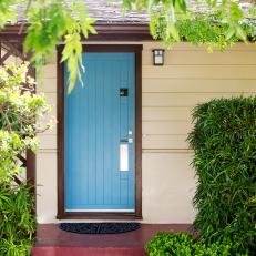 Cream Home Exterior With Aqua Blue Front Door