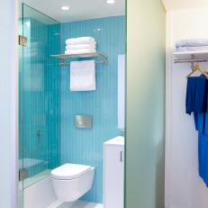 Bold Blue Master Bathroom With Nearby Closet