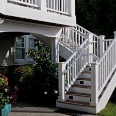 Traditional Backyard Steps With White Railing