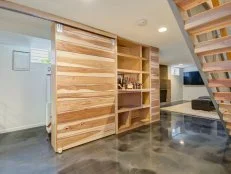 White Basement With Wood Bar, Polished Floors, Sliding Door