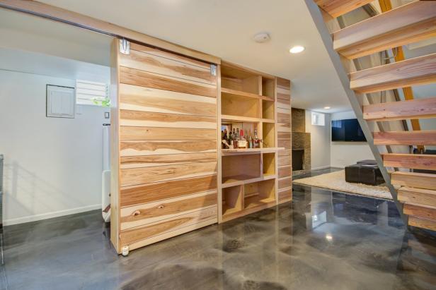 White Basement With Wood Bar, Polished Floors, Sliding Door