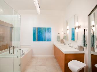 Bathroom With Wood Double Vanity, Blue Painting and Neutral Tile Floor