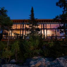 Cabin Exterior at Night With Glass Wall