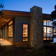 Lakefront Cabin Exterior With Stone Chimney