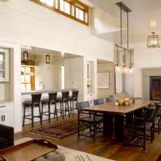 Bright Cottage Dining Room Features Salvaged Wood Floors