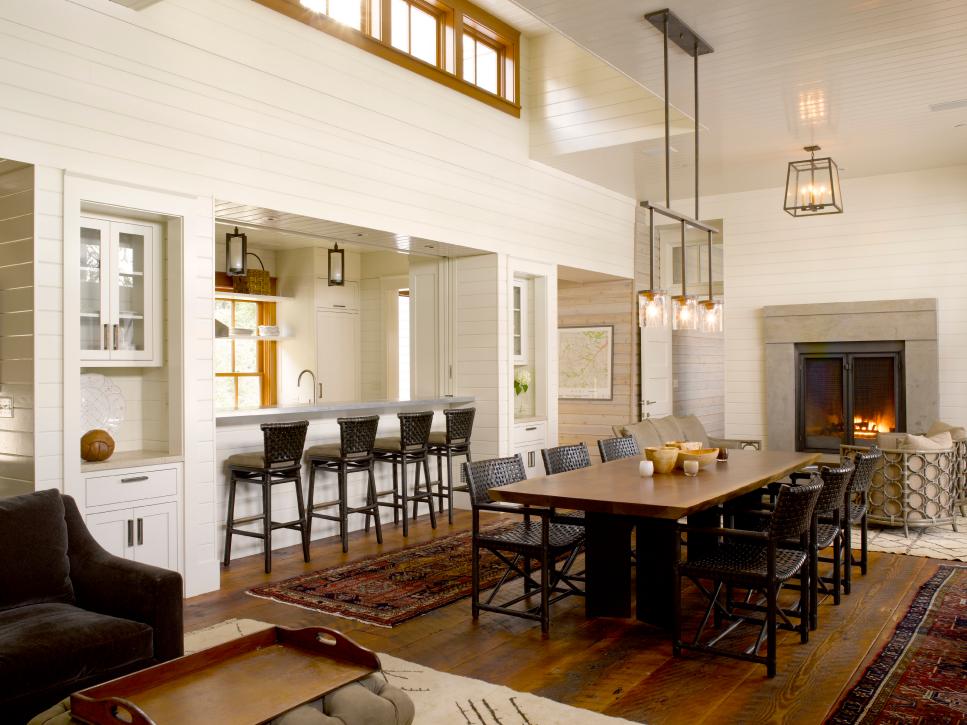Open Cottage Dining Room With White Paneling