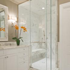 Sleek Marble and Glass Shower in Contemporary Bathroom