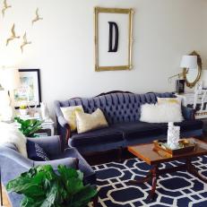Navy and White Living Room With Tufted Sofa 