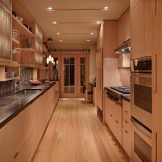Bright, Contemporary Galley Kitchen With Cedar Cabinets
