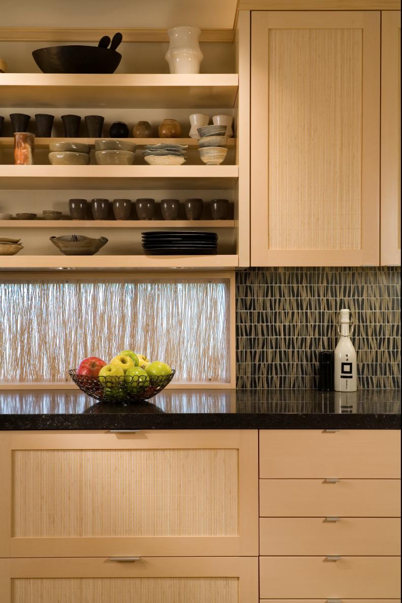 Pale Wood Kitchen Cabinets & Open Shelving With Black Countertop