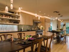 Neutral Open Kitchen With Pendant Lighting & Wooden Dining Table