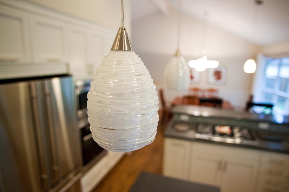 Modern Kitchen With White Glass Pendant Lights | HGTV