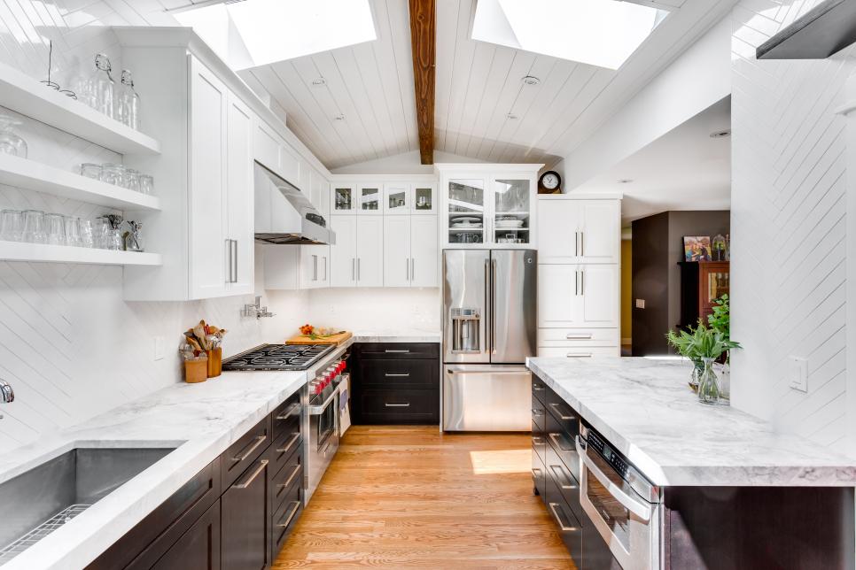 Bright Kitchen With Skylights, White Walls and Exposed Ceiling Beam
