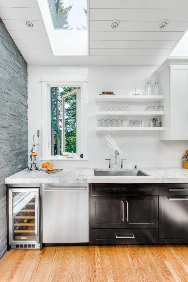 White Kitchen Wall With Floating Shelves and Herringbone Backsplash