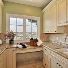 Green and White Traditional Laundry Room With View