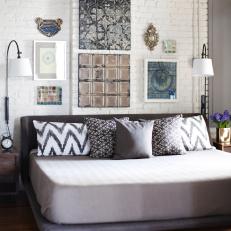 Contemporary White Bedroom With Exposed Brick Wall