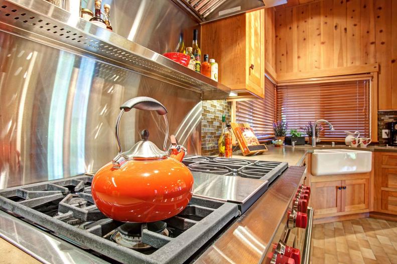 Stainless Steel Oven & Cooktop in Rustic Wood Kitchen