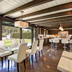 Open Midcentury Modern Dining Area With White Chairs