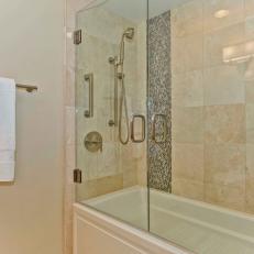 Neutral Tile Shower Boasts Mosaic Tile Accents