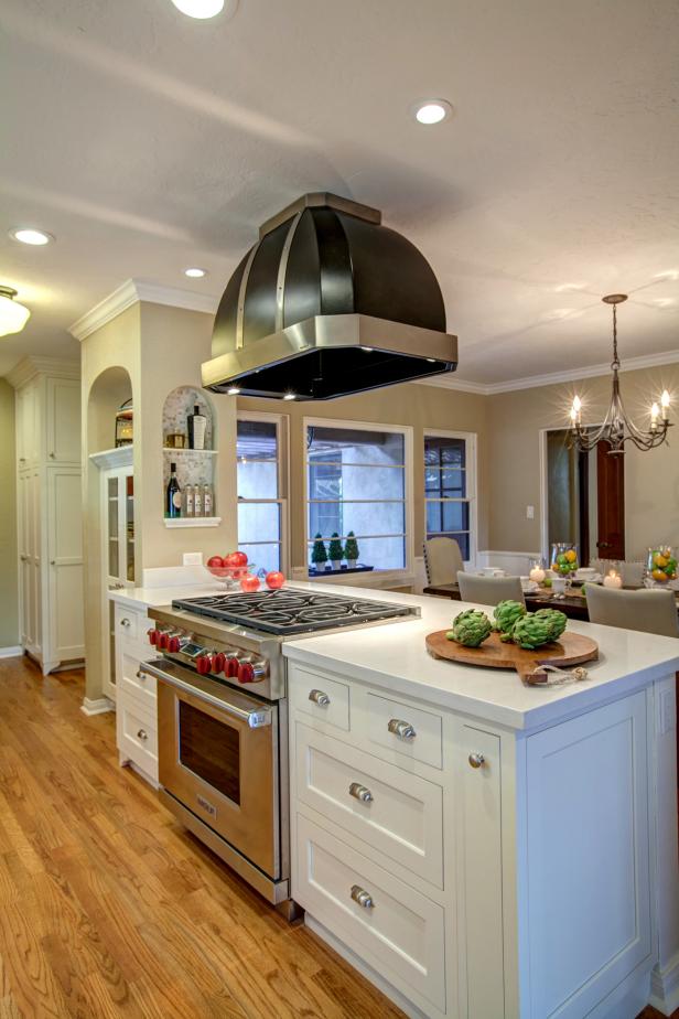 Retro Black Range Hood Above Crisp White Kitchen Island | HGTV