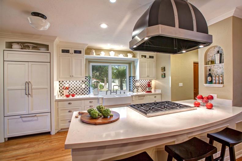 Tan Kitchen With White Cabinets, White Countertops & Black Range Hood