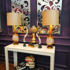 White Nailhead Trim Console Table With Brown Lamps