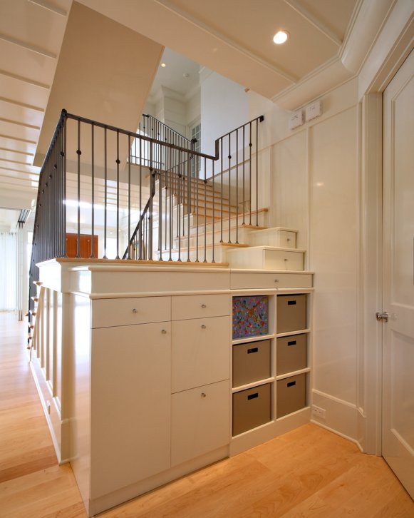 White Contemporary Custom Built-In Storage Behind Staircase