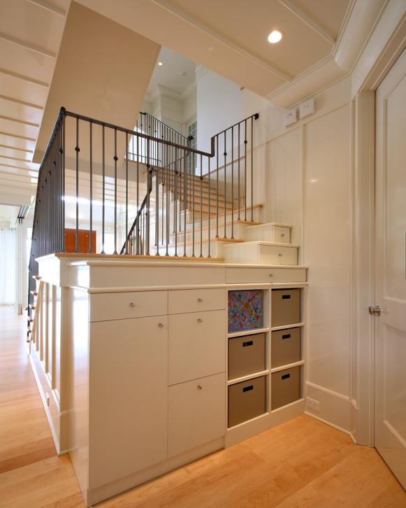 White Contemporary Custom Built-In Storage Behind Staircase