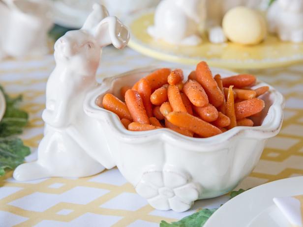 honey glazed carrots inside a white bunny dish